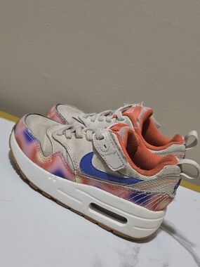 Nike Kids Beige Sneakers with Orange Lining and Blue Swoosh